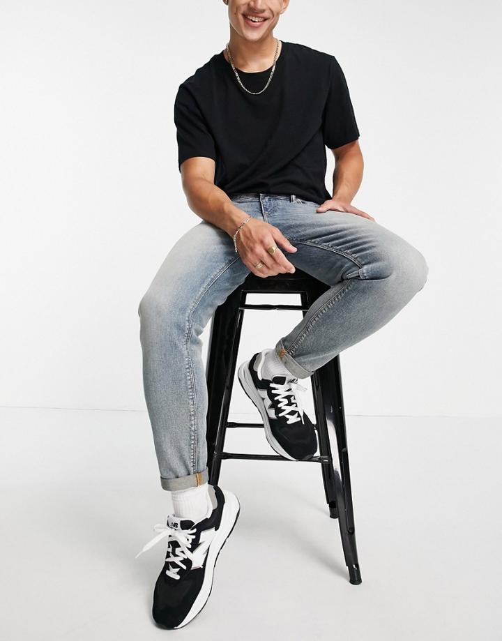 Asos Design Stretch Tapered Jeans In Vintage Dirty Wash-blues