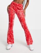 Asos Design Crushed Velvet Flare Pant With Exposed Seams In Pink