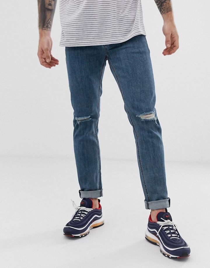 Asos Design Skinny Jeans In Flat Mid Blue With Knee Rips - Blue