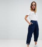 Asos Design Petite Tapered Jeans With Curved Seams And Utility Hem Pockets In Indigo - Blue