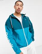 Reebok Training Essential Linear Logo Windbreaker Jacket In Color-block Blue-green