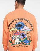 Asos Design Oversized Sweatshirt In Orange With Cartoon Back Print