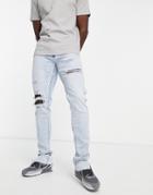 Hollister Stacked Skinny Fit Distressed/repair Jeans In Light Wash-blue