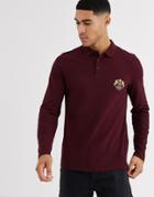 Asos Design Long Sleeve Pique Polo With Chest Emblem Print In Burgundy
