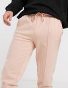 Asos Design Tapered Sweatpants With Pin Tuck In Pink
