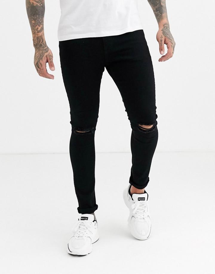 Asos Design Spray On Jeans In Power Stretch Denim In Black With Busted Knee