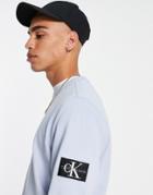 Calvin Klein Jeans Monogram Badge Sweatshirt In Light Blue