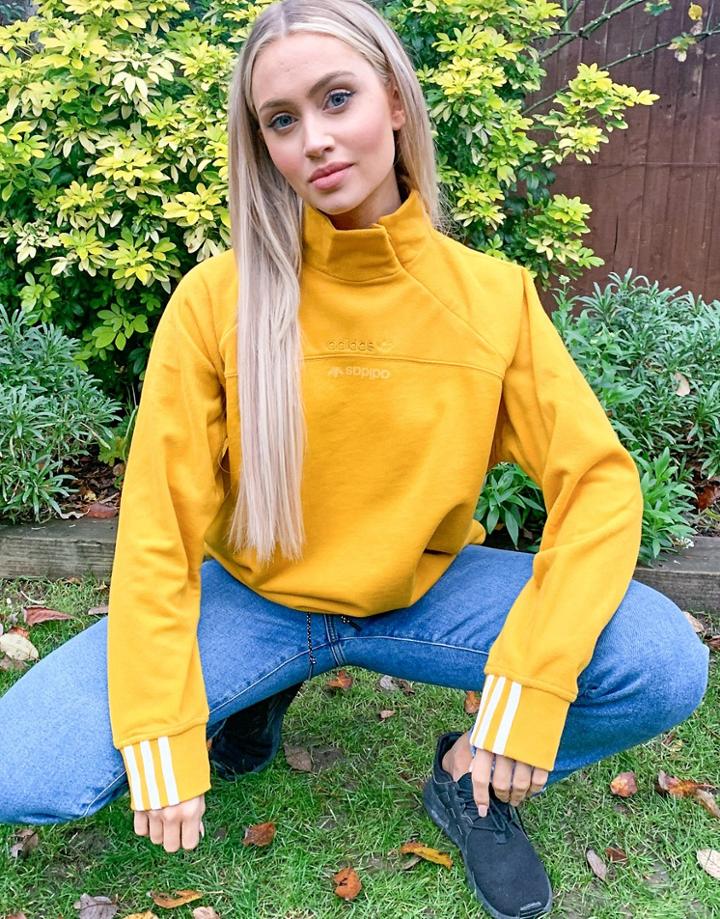 Adidas Originals Logo Ryv High Neck Fleece Sweatshirt With Drawstring Hem In Mustard-yellow