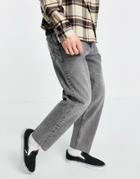 Asos Design Relaxed Tapered Jeans In Washed Black With Raw Hem