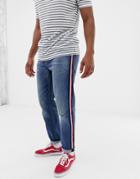 Asos Design Tapered Jeans In Mid Wash Blue With Red Side Stripe - Blue