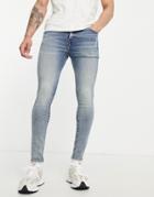 Asos Design Spray On Jeans With Powerstretch In Tinted Mid Wash-blues