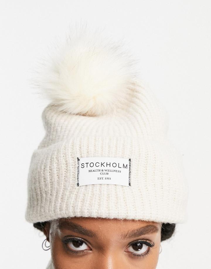 Asos Design Rib Knit Pom Beanie With Label Detail In Cream-white