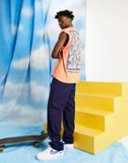 Asos Daysocial Unisex Oversized Tank Top With Large Back Graphic Print In Orange