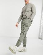 Asos Design Tapered Chino Sweatpants With Elasticized Waist In Khaki-green