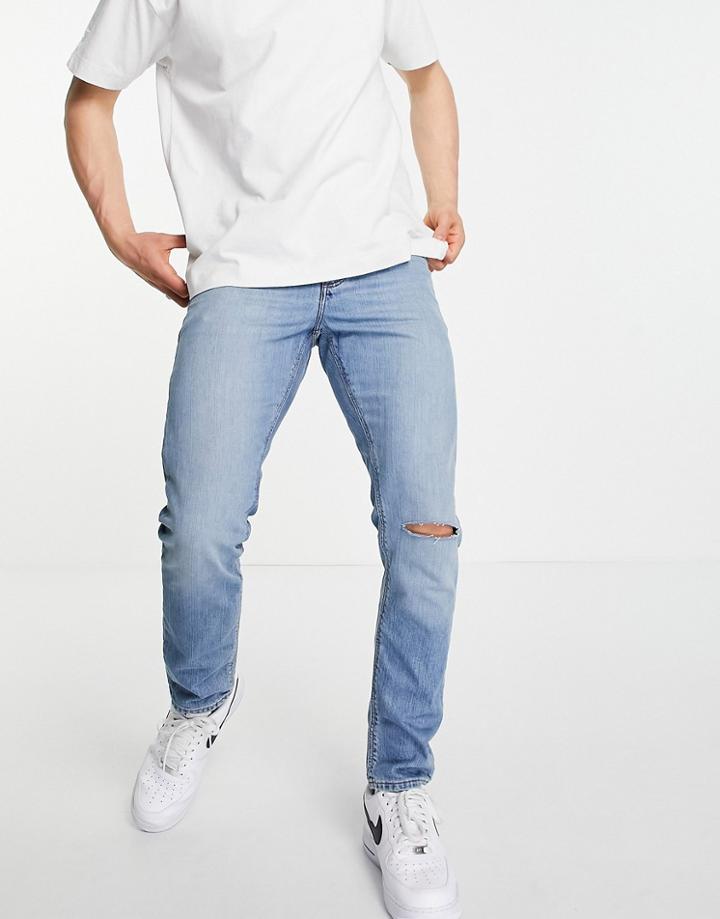 Asos Design Slim Jeans In Vintage Mid Wash With Knee Rip-blues