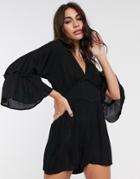 Asos Design Swing Romper With Frill Sleeve In Crinkle In Black