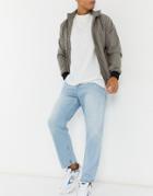 Asos Design Relaxed Tapered Jeans In Vintage Light Blue Stone Wash