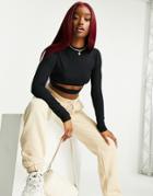 Asos Design Long Sleeve Crop Top With Under Bust Cut Out In Black