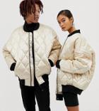 Collusion Unisex Quilted Satin Bomber In Gold