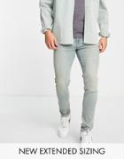 Asos Design Skinny Jeans In Tinted Mid Wash-blues