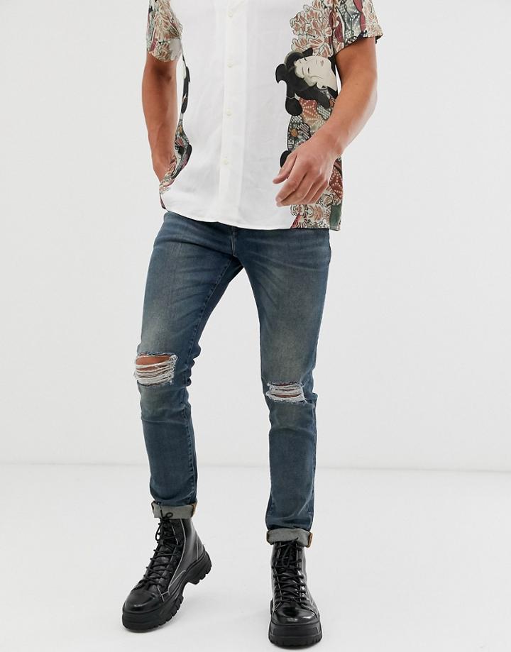Asos Design Recycled 12.5oz Skinny Jeans In Smokey Washed Blue With Busted Knees - Blue
