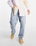 Asos Design Baggy Jeans In 90s Light Wash With Abrasions-blues