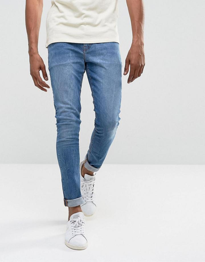 Asos Design Super Skinny Jeans In 12.5oz Mid Wash Blue