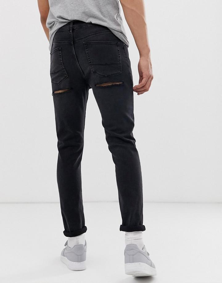 Asos Design Skinny Jeans In Washed Black With Bum Rips - Black