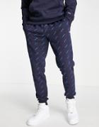 Champion All Over Logo Print Sweatpants In Navy