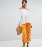 Asos Design Maternity Over The Bump Pants With Fluted Ruffle Hem In Polka Dot-orange
