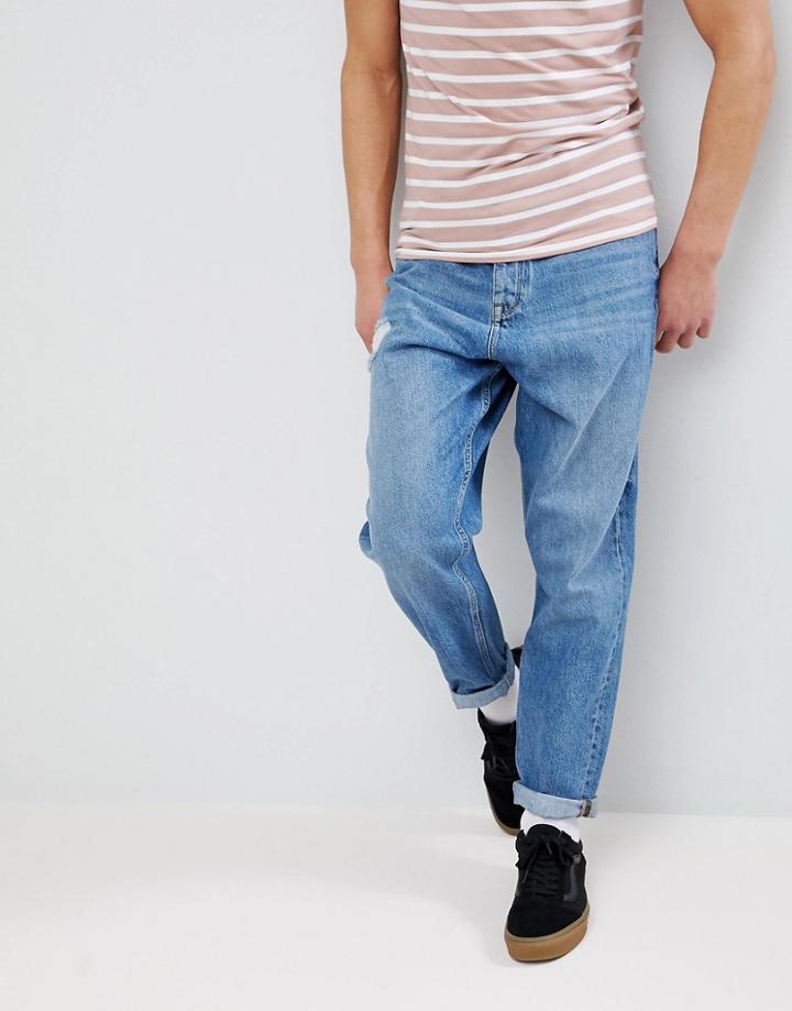 Asos Oversized Tapered Jeans In Mid Wash With Rip - Blue