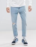 Asos Tapered Jeans In Light Wash With Rips - Blue