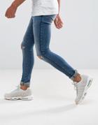Asos Extreme Super Skinny Jeans In Mid Wash With Rips And Side Detail - Blue