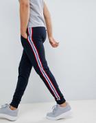 Asos Design Skinny Sweatpants With Side Stripe Taping In Navy