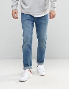 Asos Relaxed Tapered Jeans In Vintage Mid Wash Blue - Blue