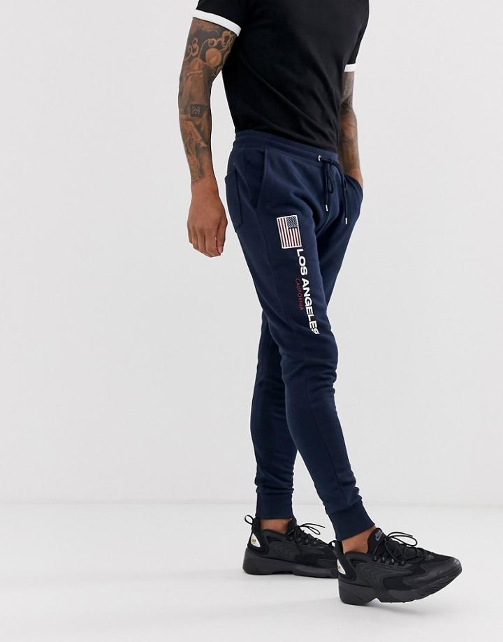 Asos Design Skinny Sweatpants With Embroidered Flag - Navy