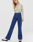 Asos Design Full Length Flare Jeans With Pressed Crease And Western Pockets In Mid Vintage Wash-blue