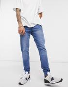 Ldn Dnm Carrot Fit Jeans In Mid Washed Blue-blues