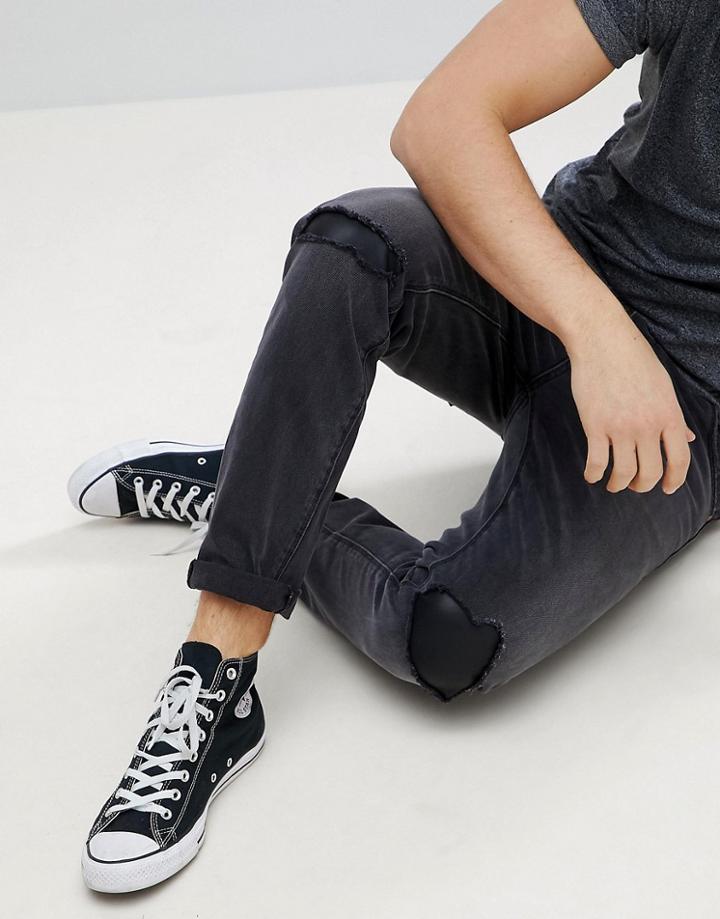 Asos Tapered Jeans In Washed Black With Faux Leather Rip & Repair - Black