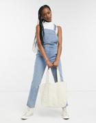 Asos Design Denim Stretch Kick Flare Overalls In Mid Wash-blues