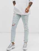 Asos Design Slim Jeans In Light Wash Blue With Heavy Rips