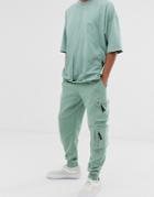Asos Design Two-piece Skinny Sweatpants With Ultility Zip Pockets In Green - Green