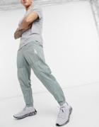 Reebok Woven Drawstring Track Pants In Khaki-green