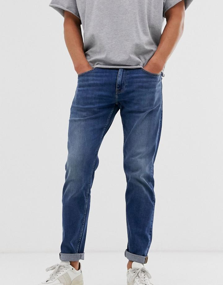 Asos Design Tapered Jeans In Dark Wash Blue