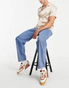 Asos Design Baggy Jeans In Mid Wash Blue-blues