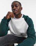 Asos Design Oversized Sweatshirt With Contrast Raglan Sleeves In White Heather & Forest Green