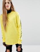 Criminal Damage Oversized Long Sleeve T-shirt With Gothic Arm Text - Yellow
