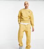 The North Face Oversized Essential Sweatpants In Yellow Exclusive To Asos-brown