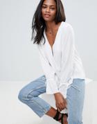 Asos Design Oversized Wrap Long Sleeve Blouse With Dip Hem-white