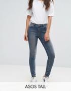 Asos Tall Lisbon Skinny Mid Rise Jeans In Dita Tinted Mid Wash With Reverse Stepped Hem - Blue